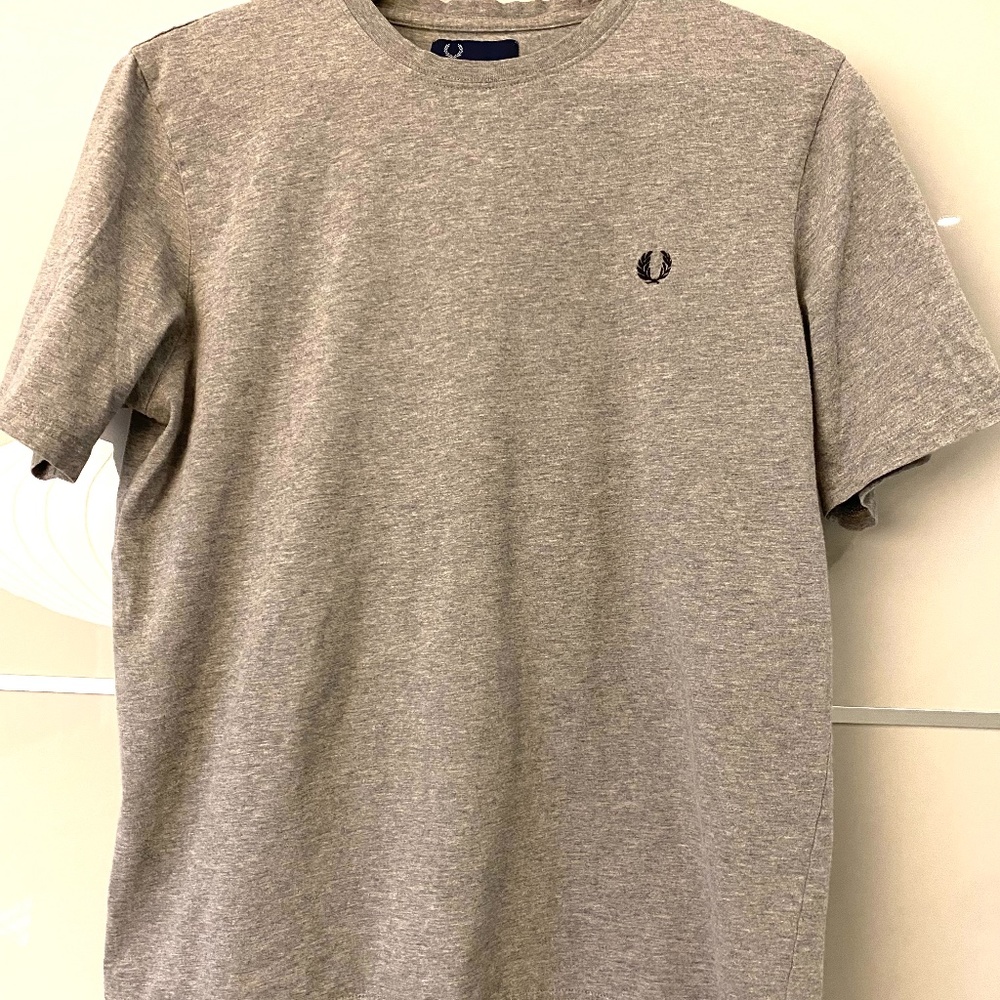 Two men's Fred Perry t-shirts.